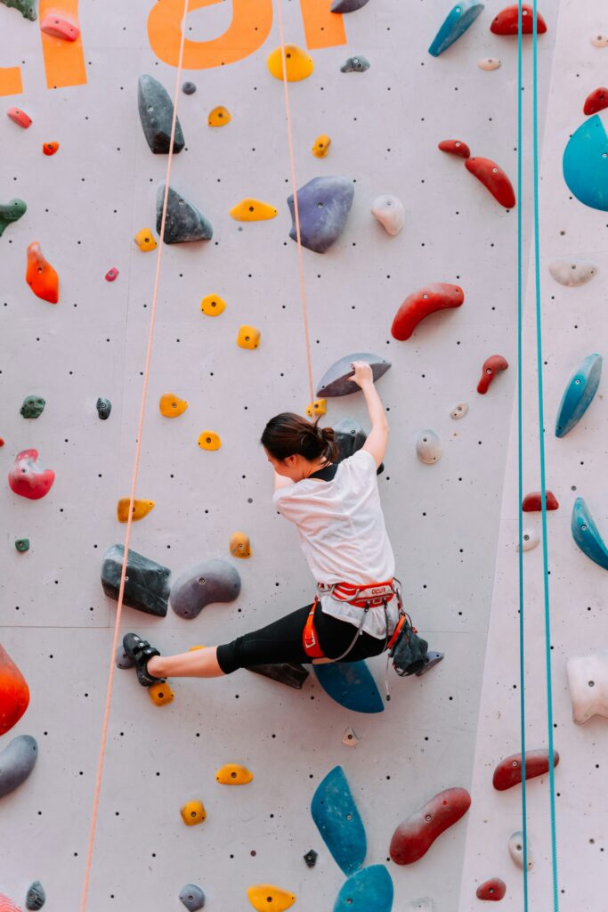 a girl doing wall climbing