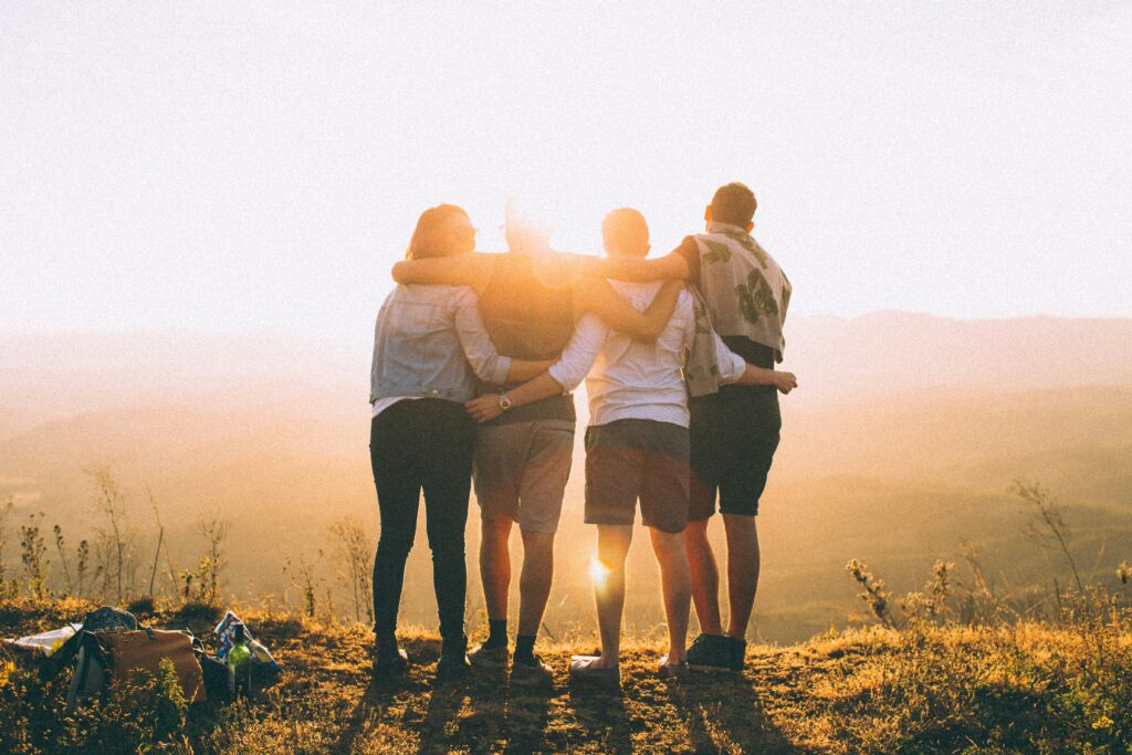 four people hugging